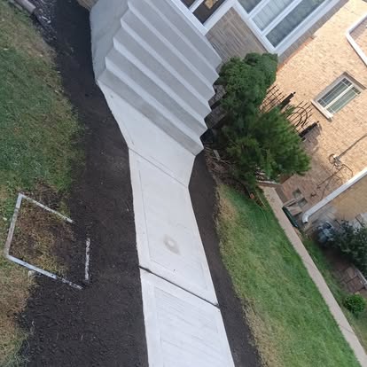 Aerial view of decorative concrete walkway with diamond cuts